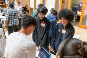 keving friends adbobe su26 demo day - Mission Bit Kevin and fellow Mission Bit students demonstrate their project to attendees at the Summer 2026 Demo Day at Adobe.