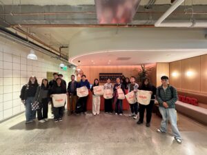 Mission Bit students and Reddit employees gather for a group photo inside Reddit’s San Francisco office.